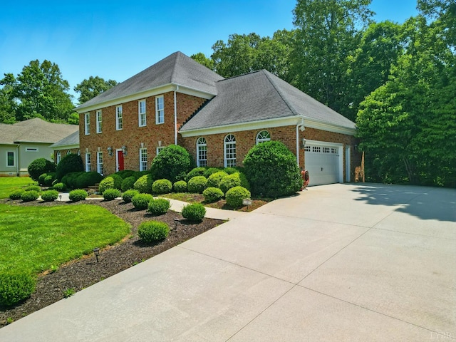 103 Waterton Dr, Lynchburg, VA 24503 - view of front of home featuring brick siding, a garage, concrete driveway, and a front lawn