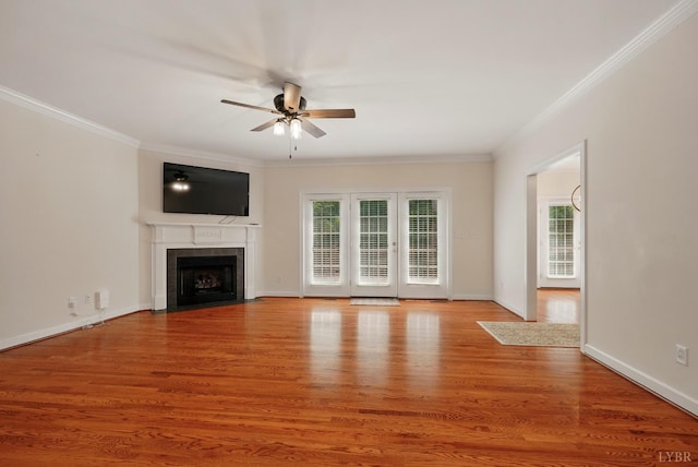 103 Waterton Dr, Lynchburg, VA 24503 - unfurnished living room with crown molding, ceiling fan, plenty of natural light, a fireplace with flush hearth, and light wood-type flooring