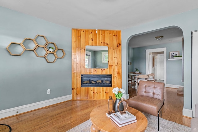 1708 Westwood Ave, Richmond, VA 23227 - living area featuring arched walkways, wood finished floors, and a fireplace