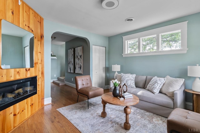 1708 Westwood Ave, Richmond, VA 23227 - living room featuring arched walkways and light wood finished floors