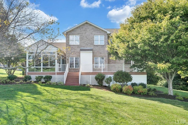 1061 Cedar Sky Ct, Forest, VA 24551 - rear view of house with a sunroom, brick siding, a yard, and stairway
