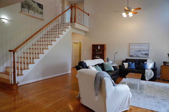 1061 Cedar Sky Ct, Forest, VA 24551 - living room with a towering ceiling, stairs, wood finished floors, baseboards, and a ceiling fan