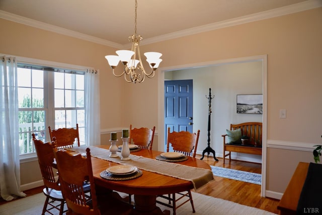 1061 Cedar Sky Ct, Forest, VA 24551 - dining area featuring light wood-style floors, a chandelier, crown molding, and baseboards