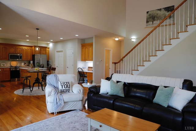 1061 Cedar Sky Ct, Forest, VA 24551 - living room with dark wood-type flooring, recessed lighting, stairs, and a high ceiling