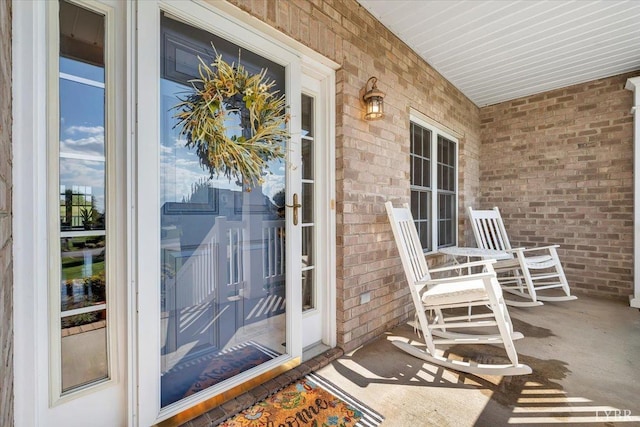 1061 Cedar Sky Ct, Forest, VA 24551 - view of exterior entry featuring brick siding and covered porch