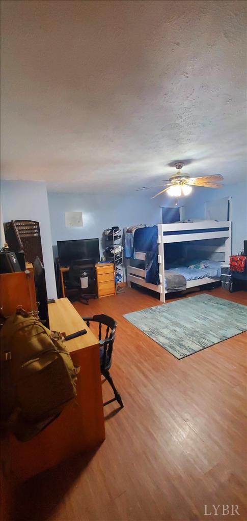 2995 Bear Creek Rd, Rustburg, VA 24588 - bedroom featuring wood finished floors and ceiling fan