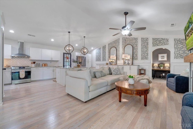1369 Timberlake Dr, Lynchburg, VA 24502 - living room featuring light wood finished floors, ceiling fan, a chandelier, recessed lighting, and a decorative wall