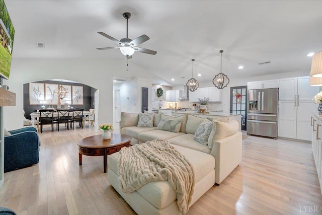 1369 Timberlake Dr, Lynchburg, VA 24502 - living room featuring lofted ceiling, arched walkways, recessed lighting, light wood-style flooring, and ceiling fan