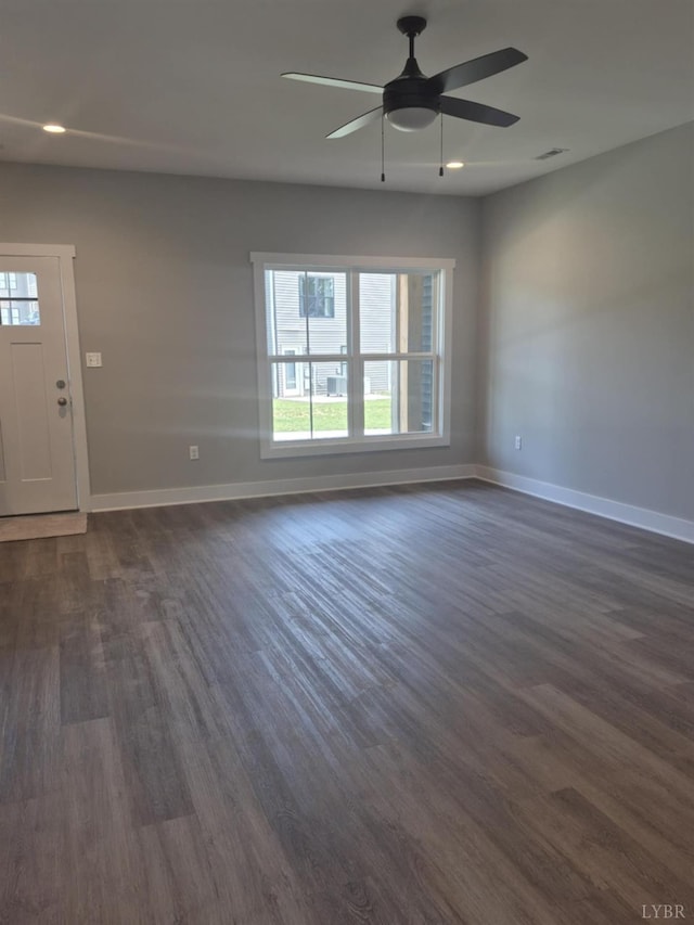 66 Pelt Ln, Evington, VA 24550 - unfurnished living room featuring healthy amount of natural light, dark wood-type flooring, baseboards, and recessed lighting