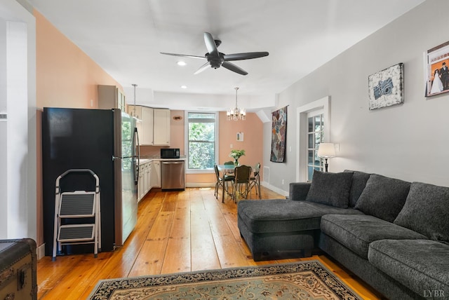1801 Floyd St, Lynchburg, VA 24501 - living room with light wood finished floors, a ceiling fan, a chandelier, and recessed lighting