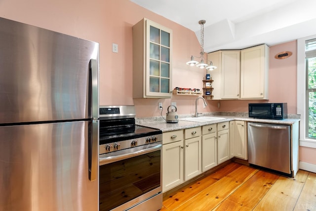 1801 Floyd St, Lynchburg, VA 24501 - kitchen featuring stainless steel appliances, a sink, light wood-style flooring, and plenty of natural light