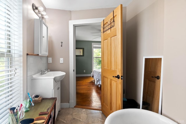 1801 Floyd St, Lynchburg, VA 24501 - bathroom featuring vanity, baseboards, a soaking tub, and ensuite bathroom