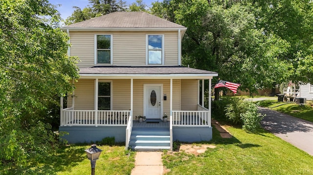 1801 Floyd St, Lynchburg, VA 24501 - view of front of property with covered porch, a front lawn, and roof with shingles