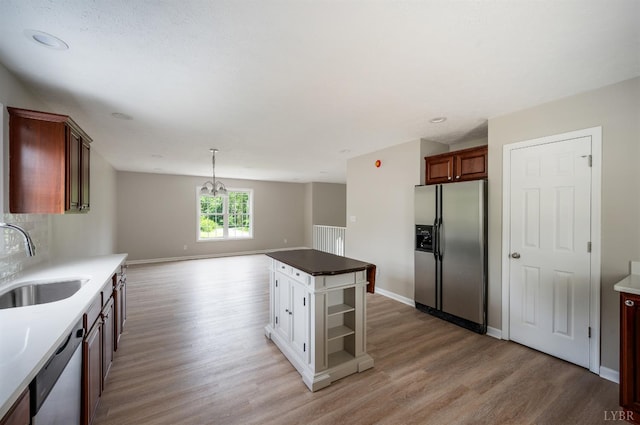 100 Creston Oaks Ct, Forest, VA 24551 - kitchen with stainless steel appliances, a sink, light wood finished floors, baseboards, and recessed lighting