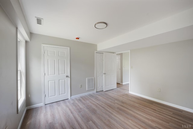100 Creston Oaks Ct, Forest, VA 24551 - unfurnished bedroom featuring light wood finished floors, baseboards, and a closet