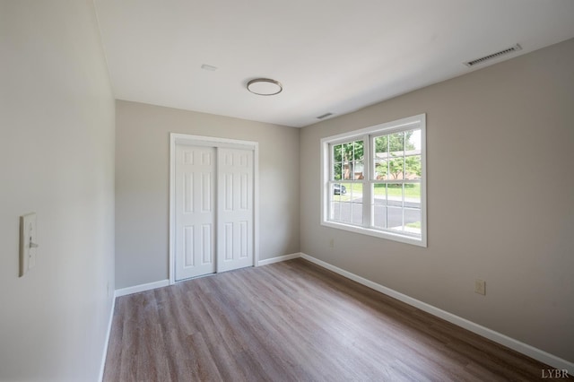 100 Creston Oaks Ct, Forest, VA 24551 - unfurnished bedroom featuring wood finished floors, a closet, and baseboards
