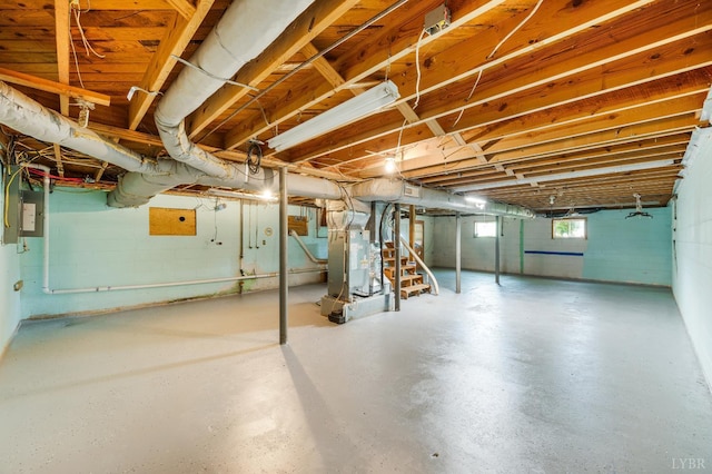 206 Huffmond St, Gretna, VA 24557 - below grade area featuring stairs, heating unit, electric panel, and concrete block wall