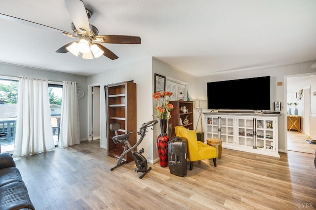 206 Huffmond St, Gretna, VA 24557 - living area featuring wood finished floors, ceiling fan, ornamental molding, and wooden walls