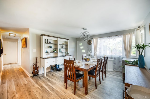 206 Huffmond St, Gretna, VA 24557 - dining room featuring light wood-style flooring and a chandelier