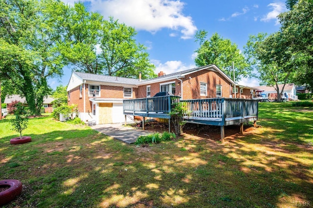 206 Huffmond St, Gretna, VA 24557 - rear view of house with brick siding, a deck, a lawn, and a chimney