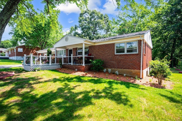 206 Huffmond St, Gretna, VA 24557 - view of front of home with brick siding and a front yard