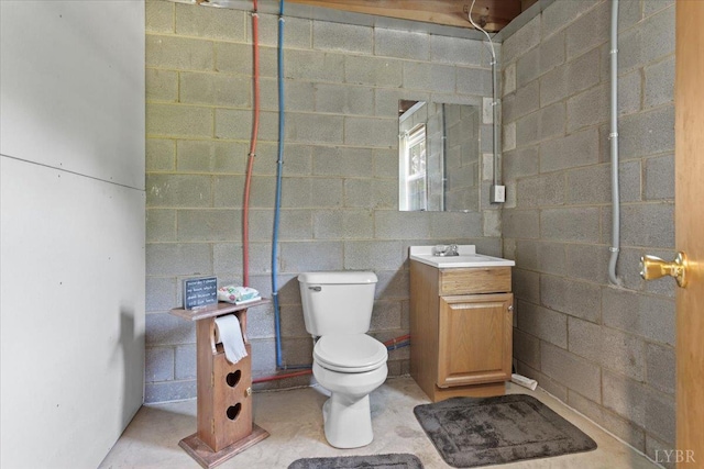 10567 Leesville Rd, Lynch Station, VA 24571 - bathroom featuring vanity, toilet, and concrete block wall