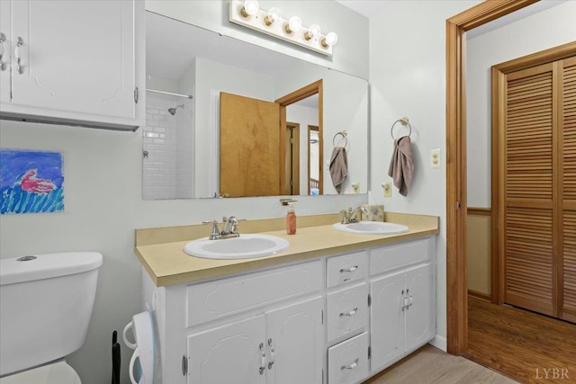 10567 Leesville Rd, Lynch Station, VA 24571 - full bath with toilet, double vanity, wood finished floors, and a closet