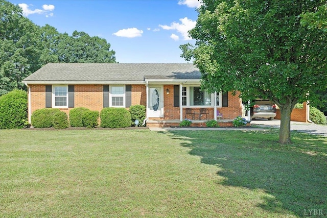 10567 Leesville Rd, Lynch Station, VA 24571 - ranch-style house with covered porch, a front yard, brick siding, gravel driveway, and a carport
