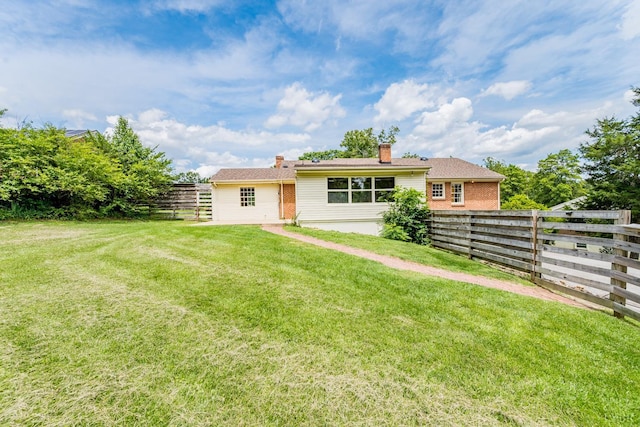 2207 Indian Hill Rd, Lynchburg, VA 24503 - rear view of property with a fenced backyard, a chimney, and brick siding