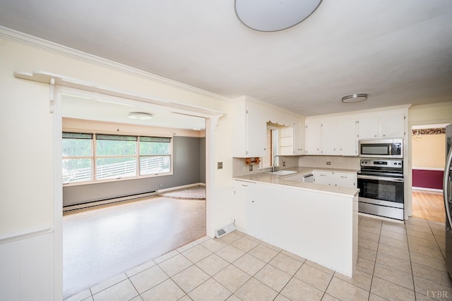 2207 Indian Hill Rd, Lynchburg, VA 24503 - kitchen featuring appliances with stainless steel finishes, a baseboard radiator, a peninsula, light countertops, and white cabinets
