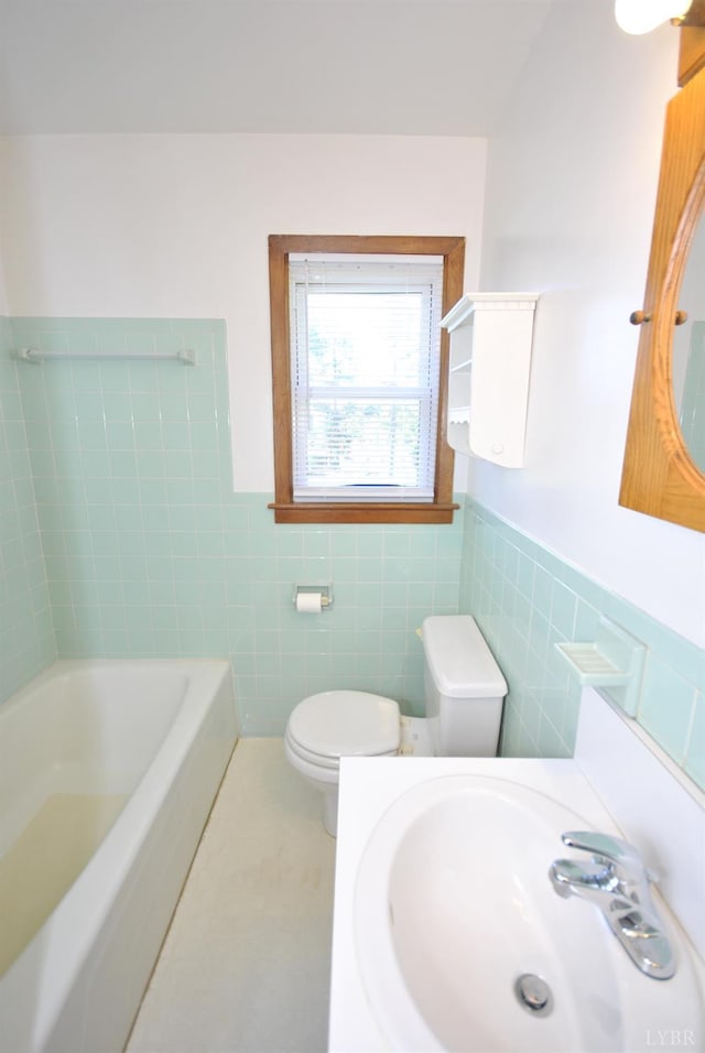 112 Half Moon Ln, Rustburg, VA 24588 - bathroom featuring tile walls, a bath, wainscoting, and tile patterned floors