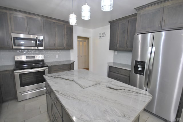 112 Half Moon Ln, Rustburg, VA 24588 - kitchen with stainless steel appliances, light tile patterned floors, tasteful backsplash, dark brown cabinetry, and light stone countertops