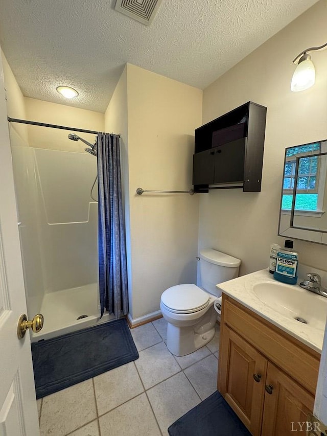 8 Northgate Ct, Lynch Station, VA 24571 - bathroom featuring vanity, a shower stall, a textured ceiling, and tile patterned floors