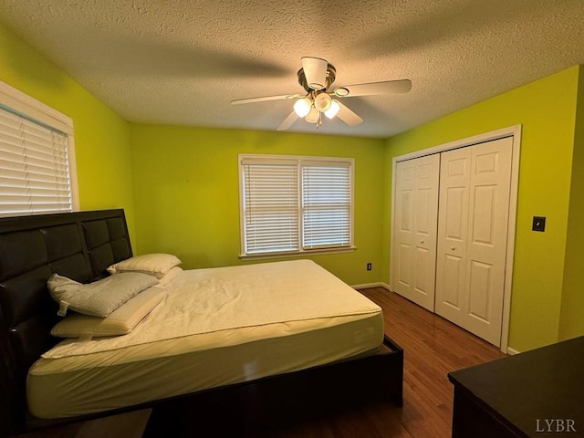 8 Northgate Ct, Lynch Station, VA 24571 - bedroom featuring dark wood-style flooring, a closet, a textured ceiling, and a ceiling fan