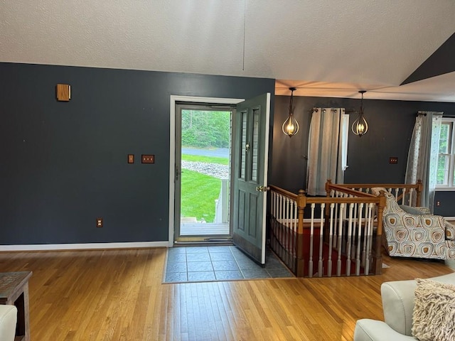 8 Northgate Ct, Lynch Station, VA 24571 - entrance foyer with lofted ceiling, wood finished floors, and a textured ceiling