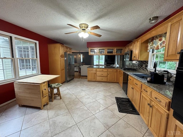 8 Northgate Ct, Lynch Station, VA 24571 - kitchen with stainless steel appliances, a peninsula, a ceiling fan, backsplash, and light tile patterned floors