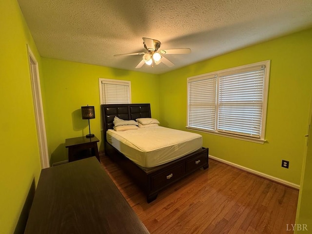 8 Northgate Ct, Lynch Station, VA 24571 - bedroom with wood finished floors, a textured ceiling, and a ceiling fan