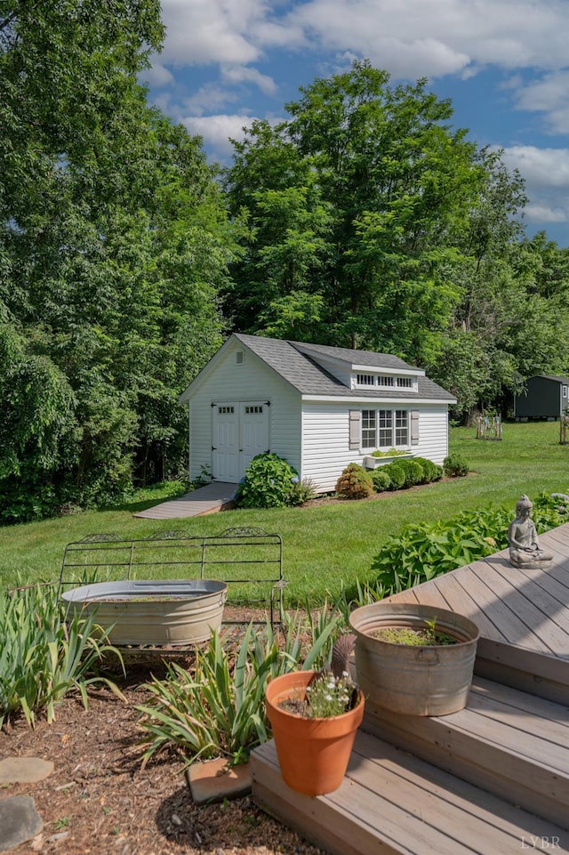 136 Timber Ridge Dr, Forest, VA 24551 - view of green lawn featuring a detached garage, an outbuilding, and a wooden deck