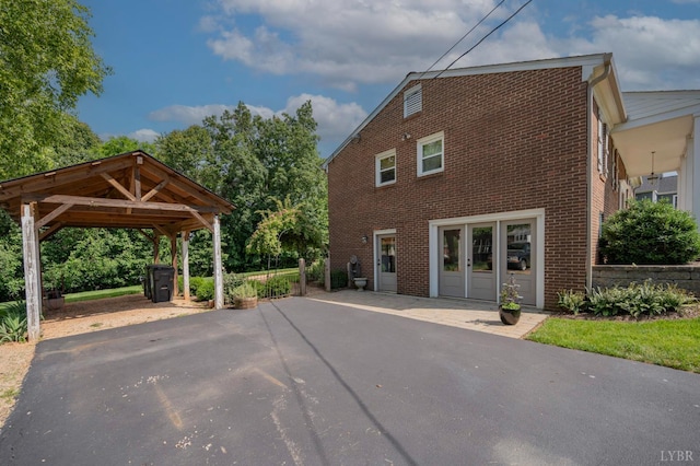 136 Timber Ridge Dr, Forest, VA 24551 - view of home's exterior featuring brick siding and asphalt driveway