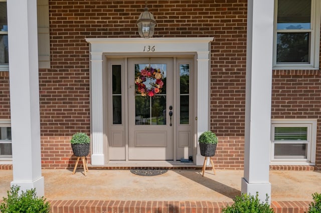 136 Timber Ridge Dr, Forest, VA 24551 - view of exterior entry with brick siding and covered porch