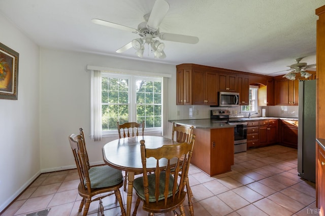 200 Middleboro Pl, Lynchburg, VA 24502 - kitchen featuring stainless steel appliances, ceiling fan, a peninsula, and plenty of natural light
