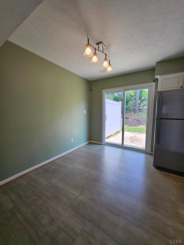 542 Leesville Rd Unit 104, Lynchburg, VA 24502 - unfurnished dining area with a textured ceiling