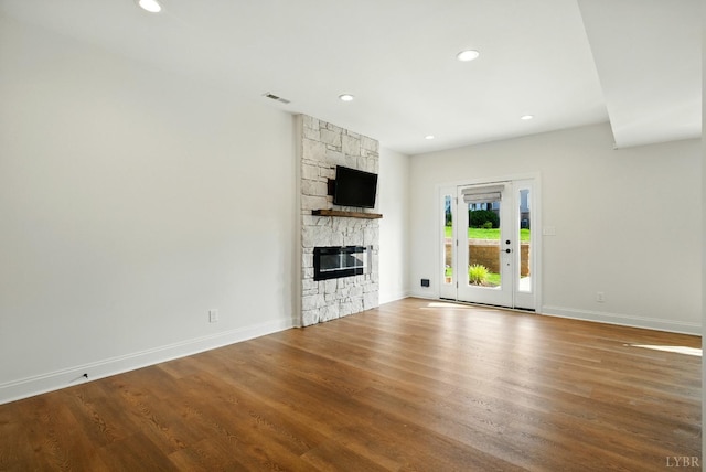 1036 Brownstone Dr, Forest, VA 24551 - unfurnished living room with a stone fireplace, wood finished floors, and recessed lighting