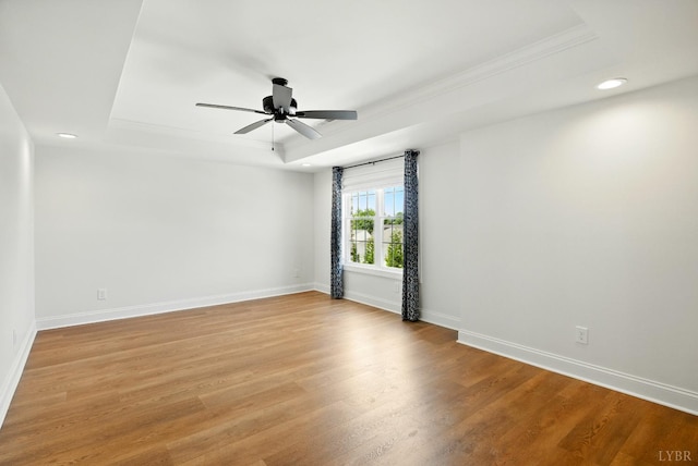 1036 Brownstone Dr, Forest, VA 24551 - empty room with a raised ceiling, light wood-style floors, recessed lighting, a ceiling fan, and crown molding