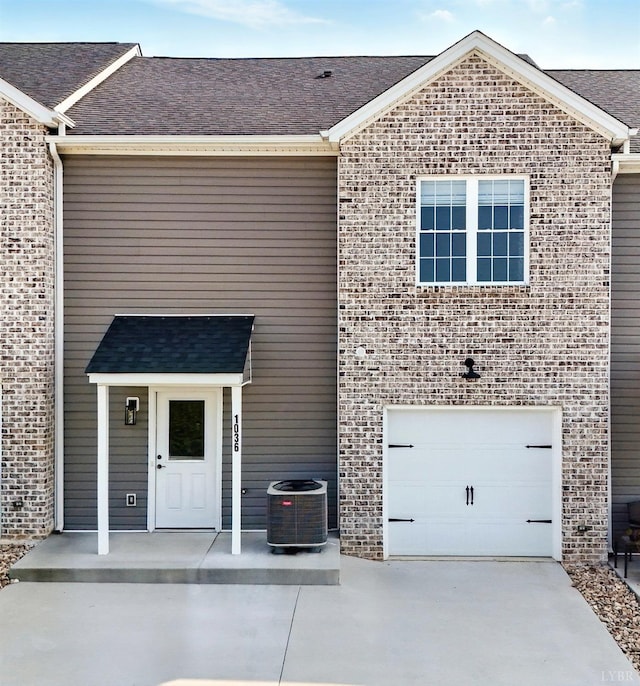 1036 Brownstone Dr, Forest, VA 24551 - view of front of property with driveway, brick siding, a garage, and a shingled roof