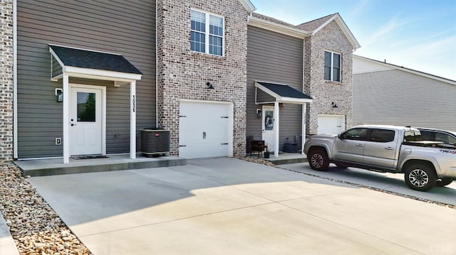 1036 Brownstone Dr, Forest, VA 24551 - view of front of property featuring driveway, brick siding, and an attached garage