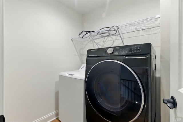 1036 Brownstone Dr, Forest, VA 24551 - laundry room with independent washer and dryer and baseboards