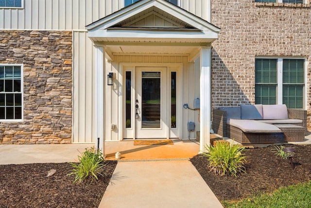 1036 Brownstone Dr, Forest, VA 24551 - entrance to property featuring stone siding, board and batten siding, and brick siding