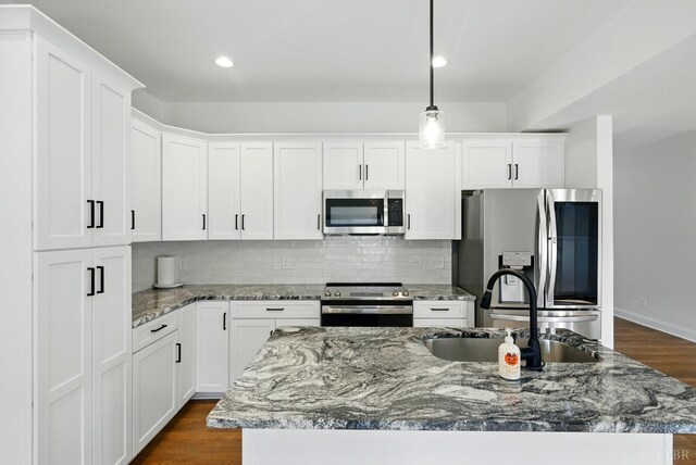 1036 Brownstone Dr, Forest, VA 24551 - kitchen featuring appliances with stainless steel finishes, decorative backsplash, white cabinetry, and recessed lighting