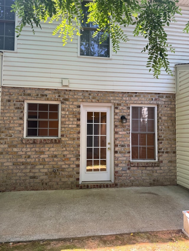 2004 Wards Ferry Rd Unit 15, Lynchburg, VA 24502 - doorway to property featuring a patio area and brick siding